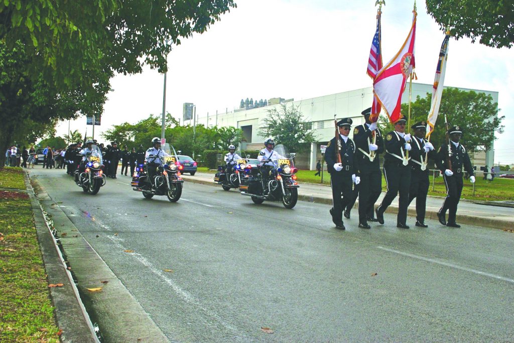 Law enforcement students marching to their graduation.