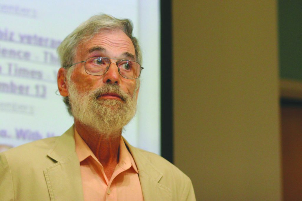 Journalist Arnold Markowitz speaking with students.