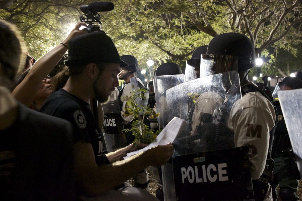 Protesters speaking with police.