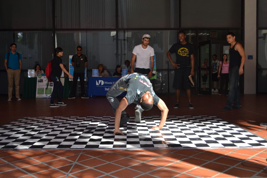 Student break dancing at Wolfson Campus.