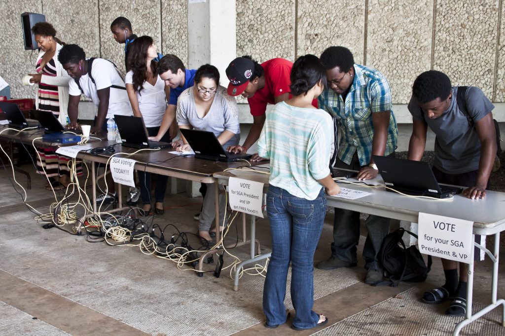 Students voting at the polls.