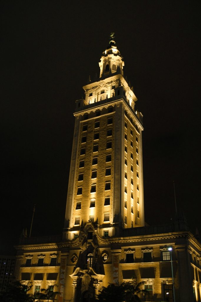 The Freedom Tower lit up in white.