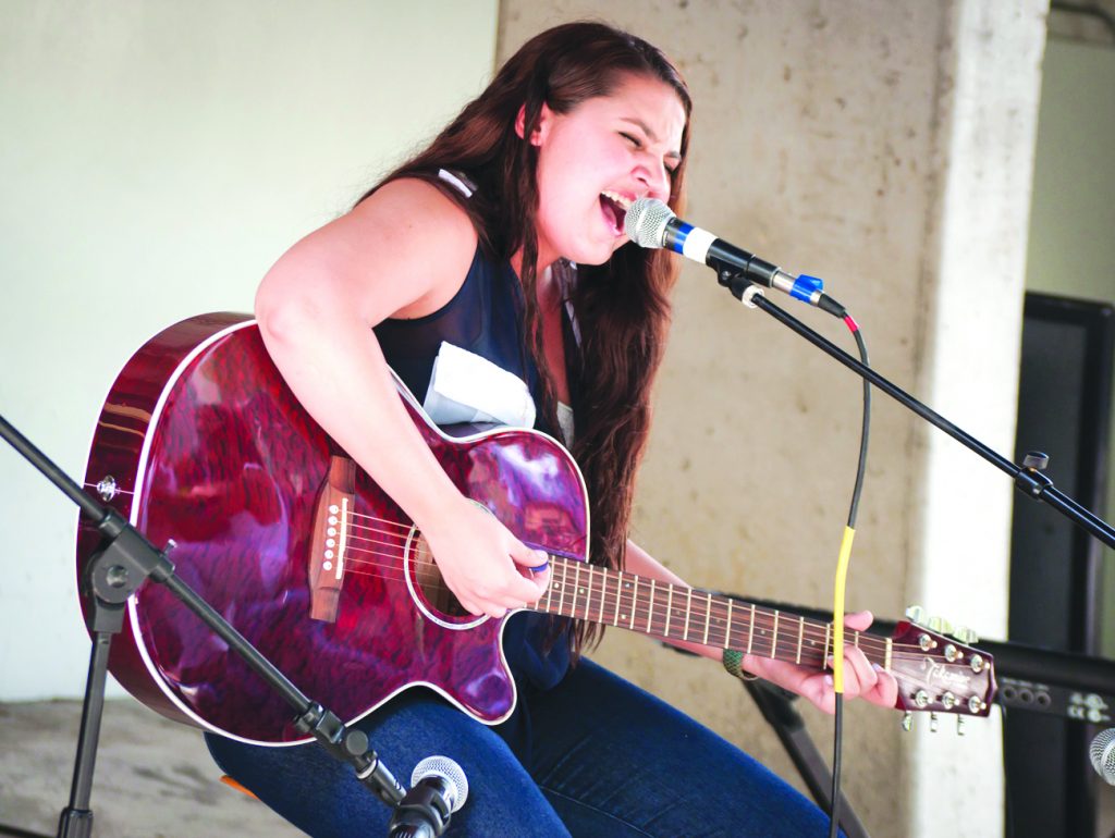 Student performing at Kendall Campus.
