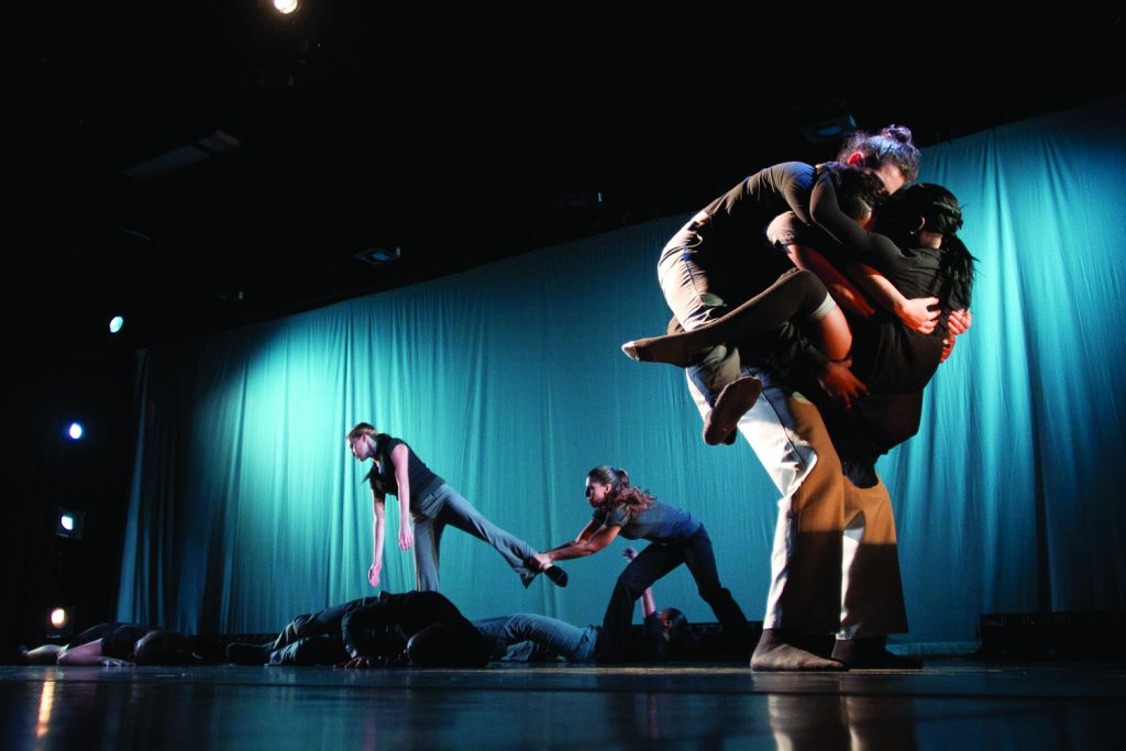 Student dancers performing on stage.