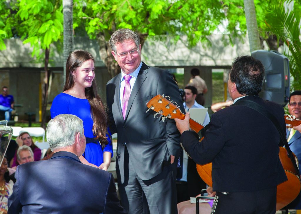 Congressman Joe Garcia posing with his daughter.