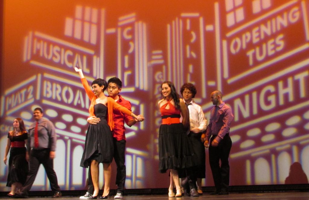 Students performing on stage.