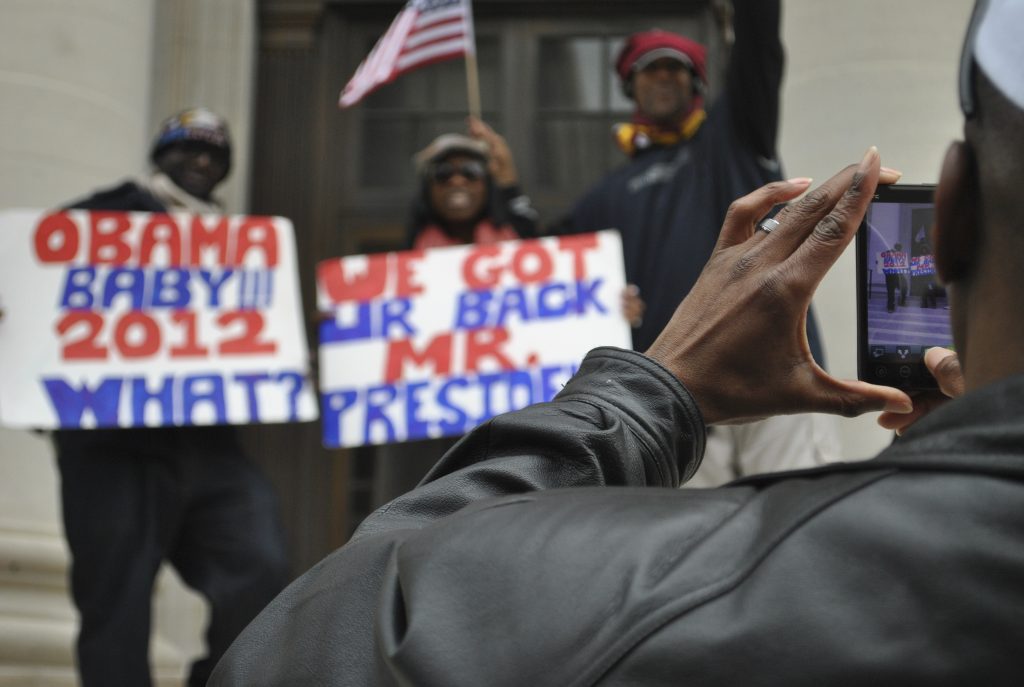 Obama supporters posing for the camera.