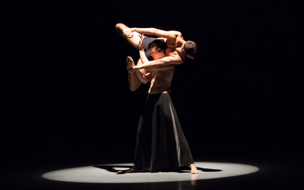 Dancers performing on stage.