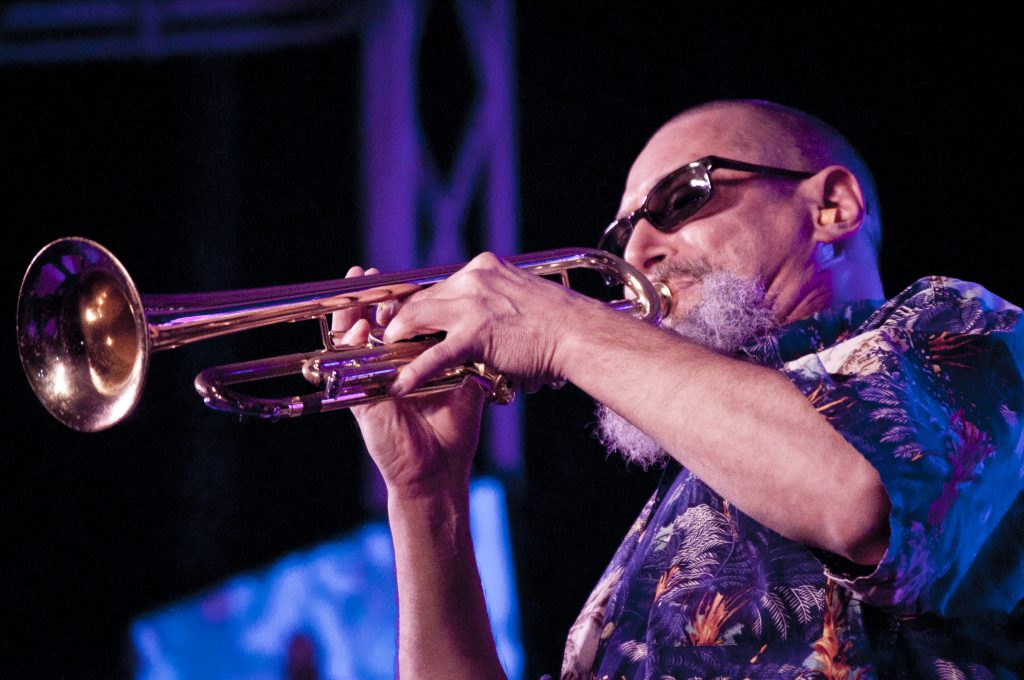 Jim Seeley performing a trumpet solo at Kendall Campus.