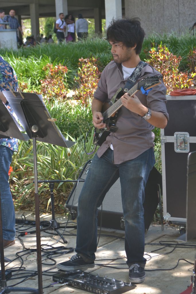 Student playing guitar.