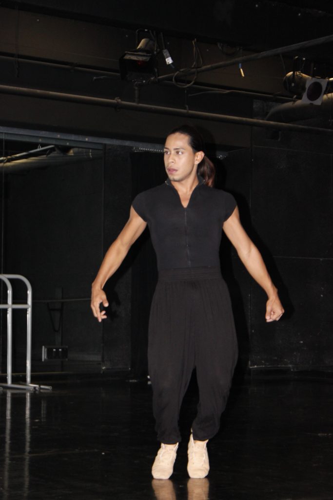 Student performing his choreography in dance composition class.