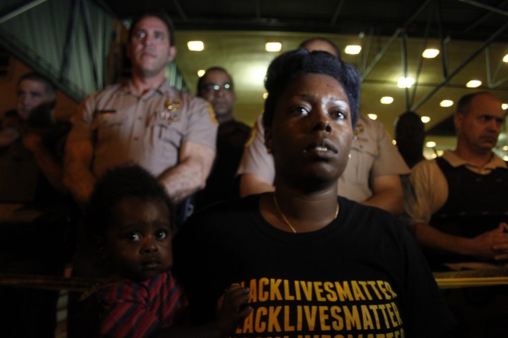 A community organizer staring at the protesters.