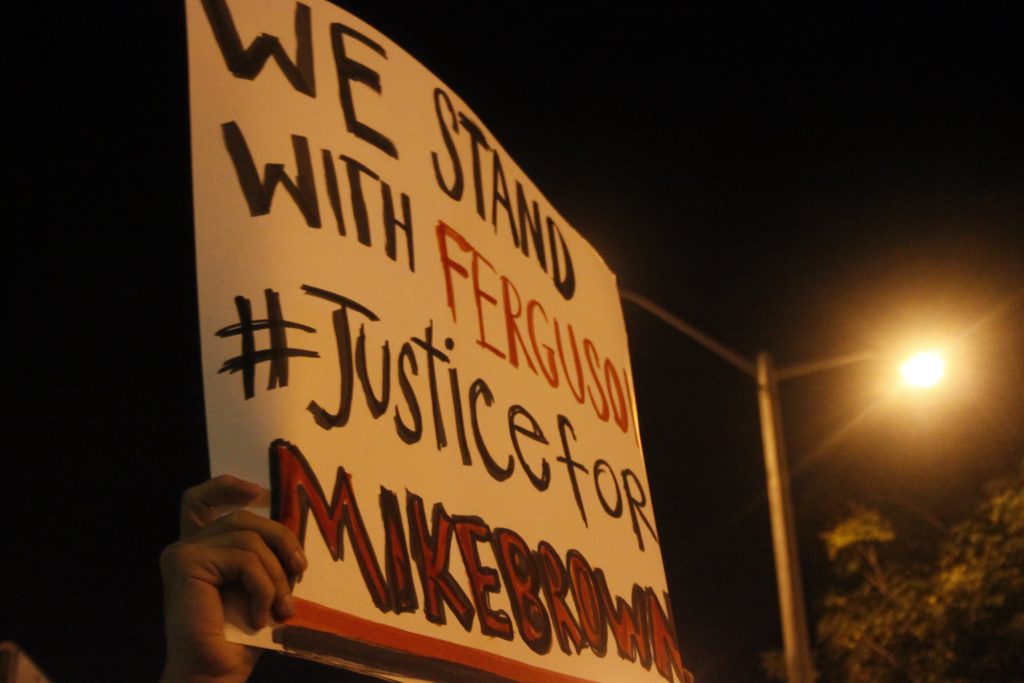 A protest sign being held up.