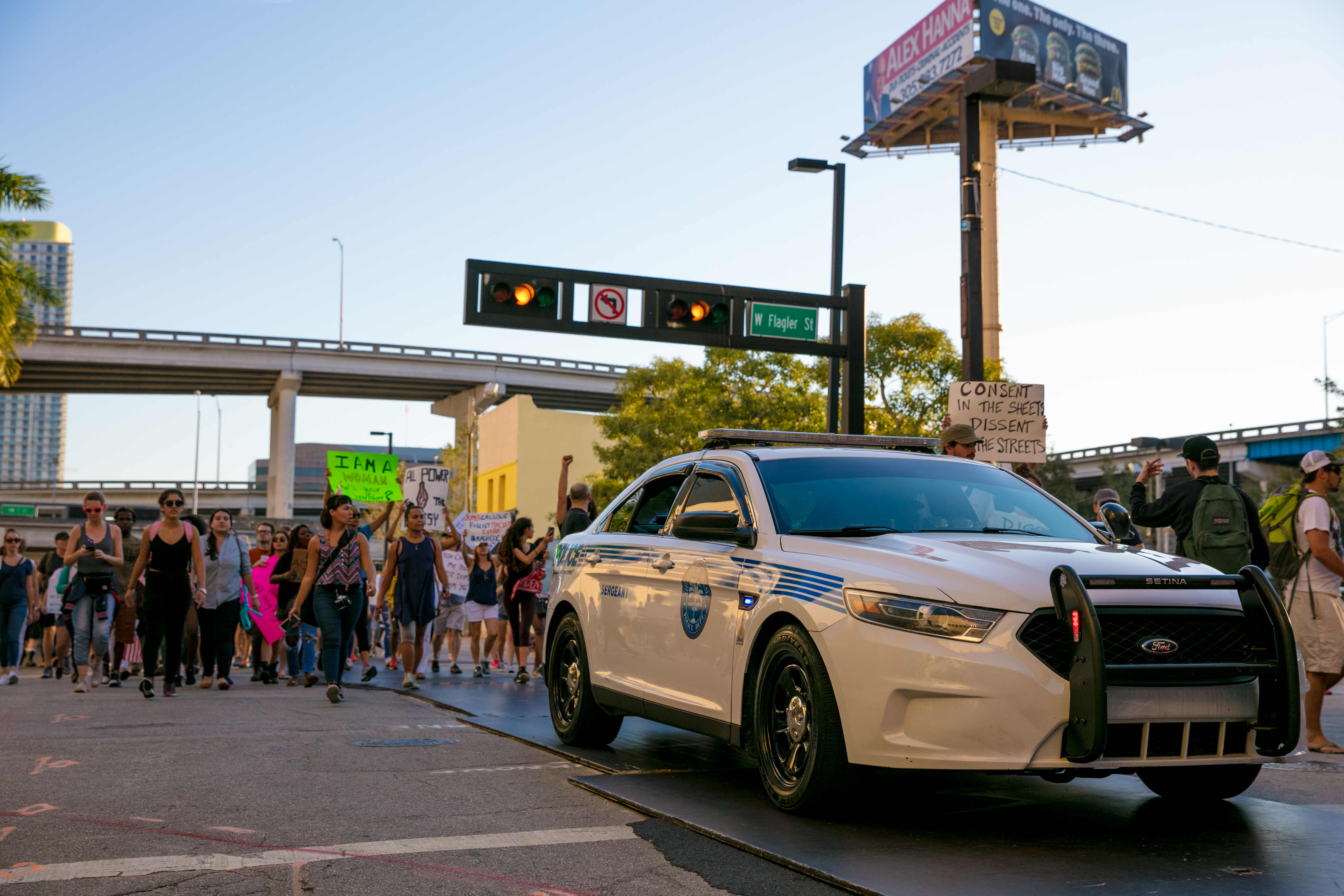 Image of protesters next to police.