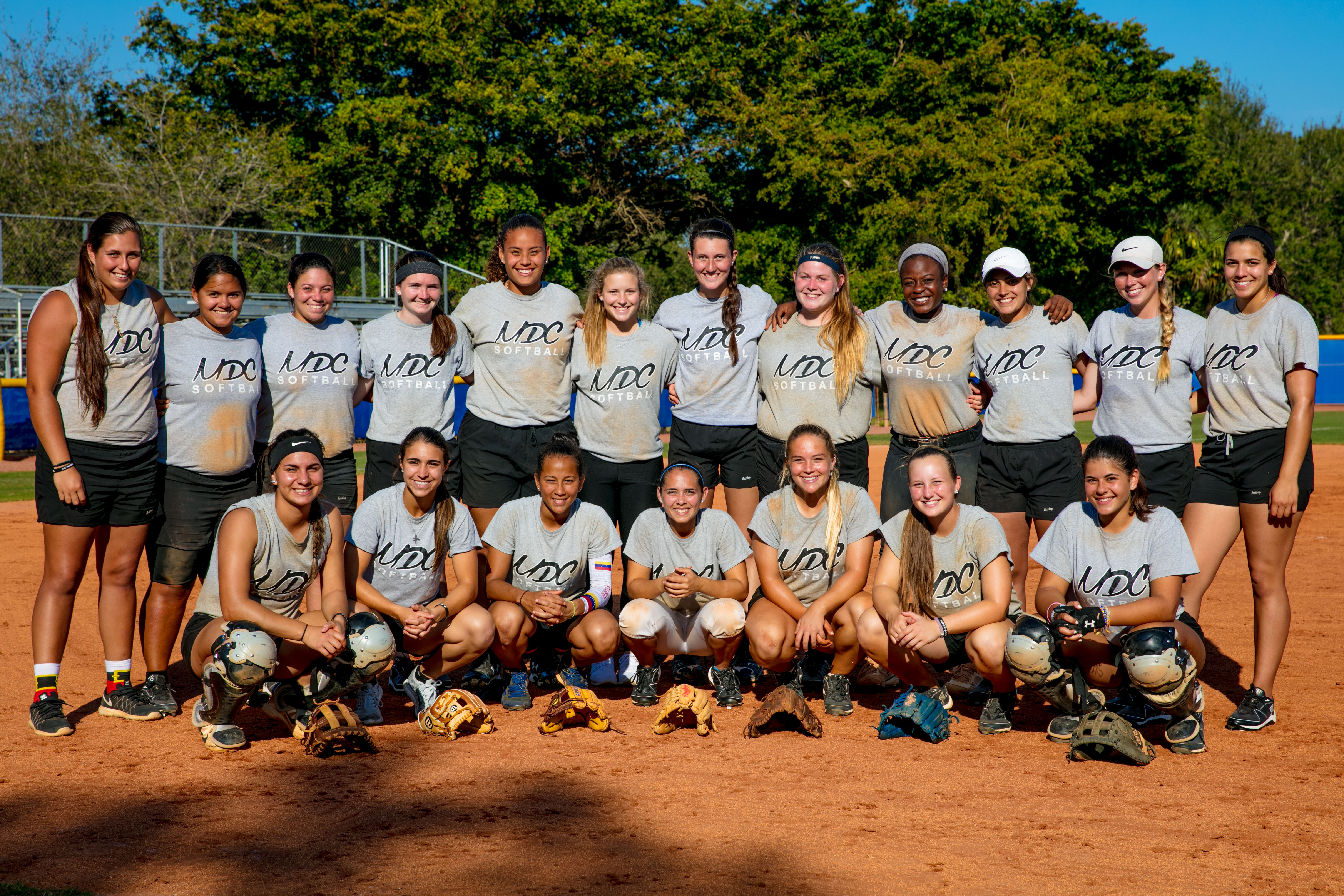 The Lady Sharks softball team posing for a picture.