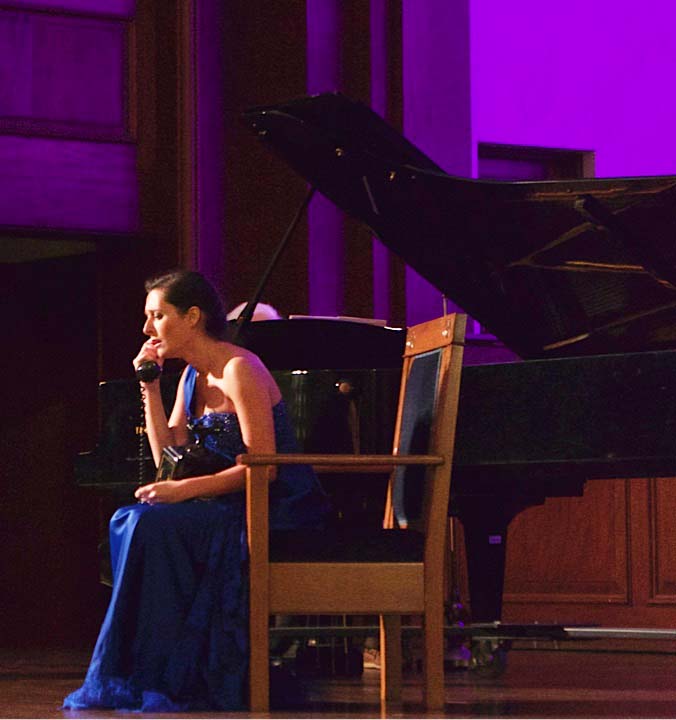 Singer performing on stage.