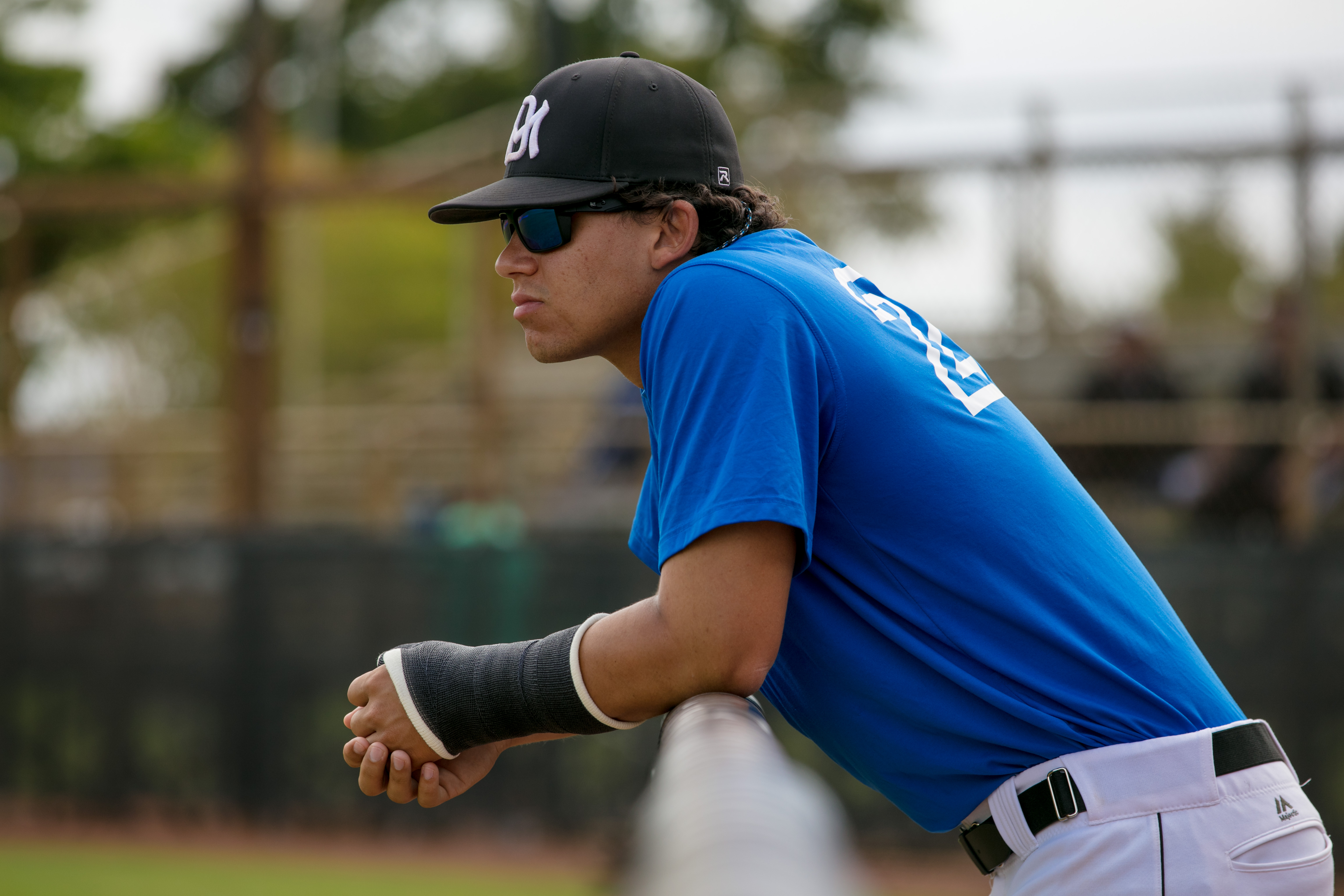 Jordan Santos watching from the dugout.