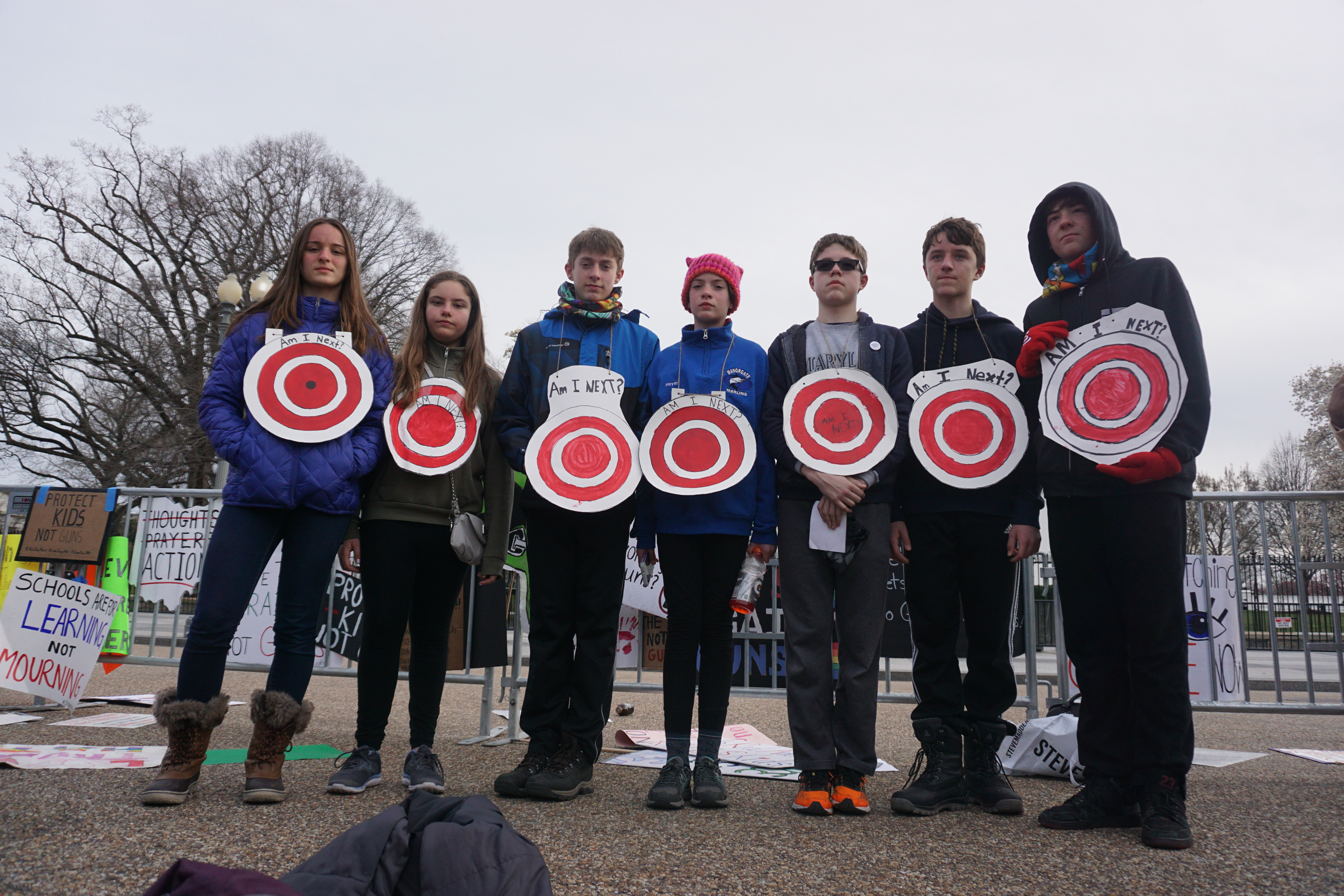 Students holding up their protest signs at March For Our Lives.