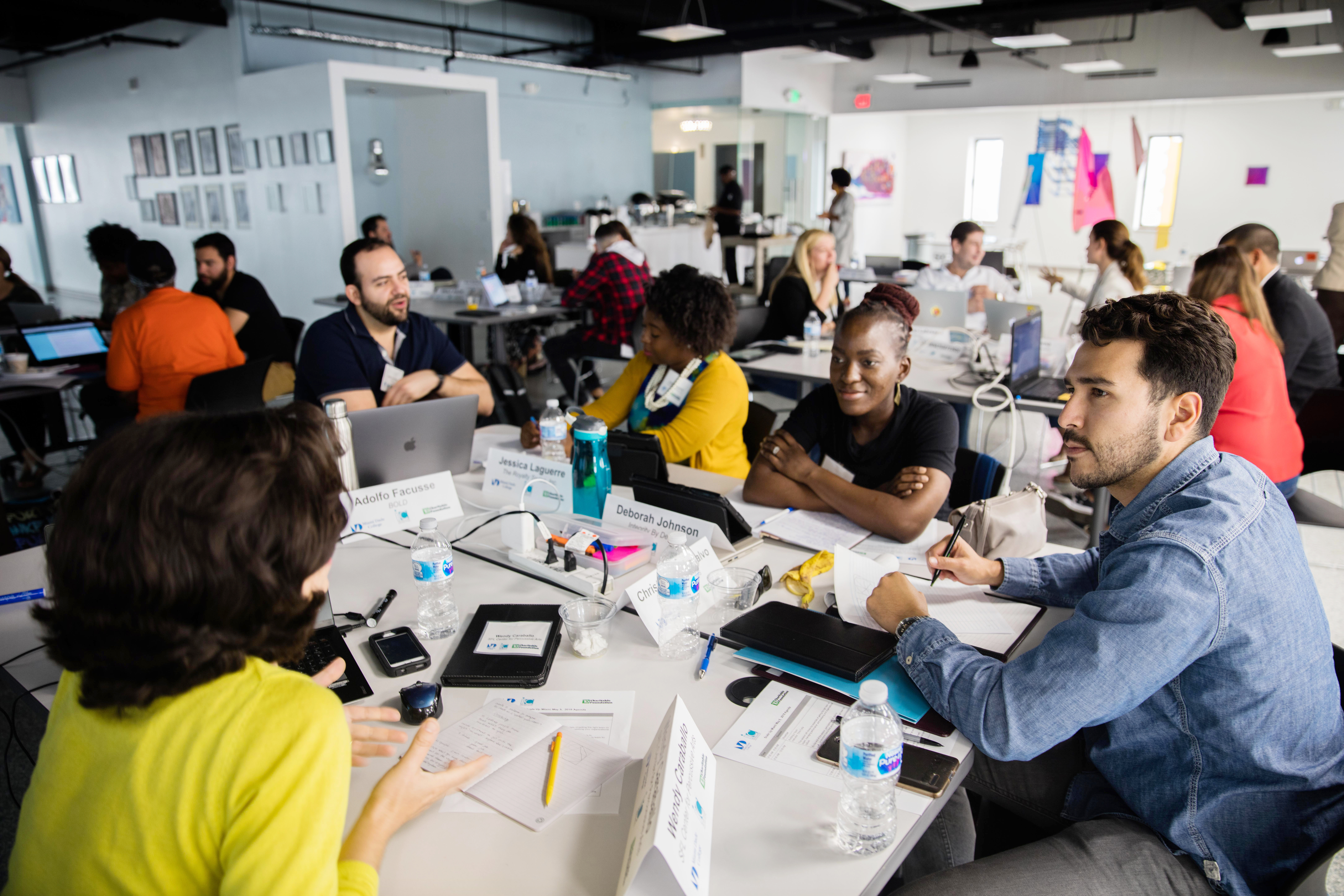 People talking at a table.