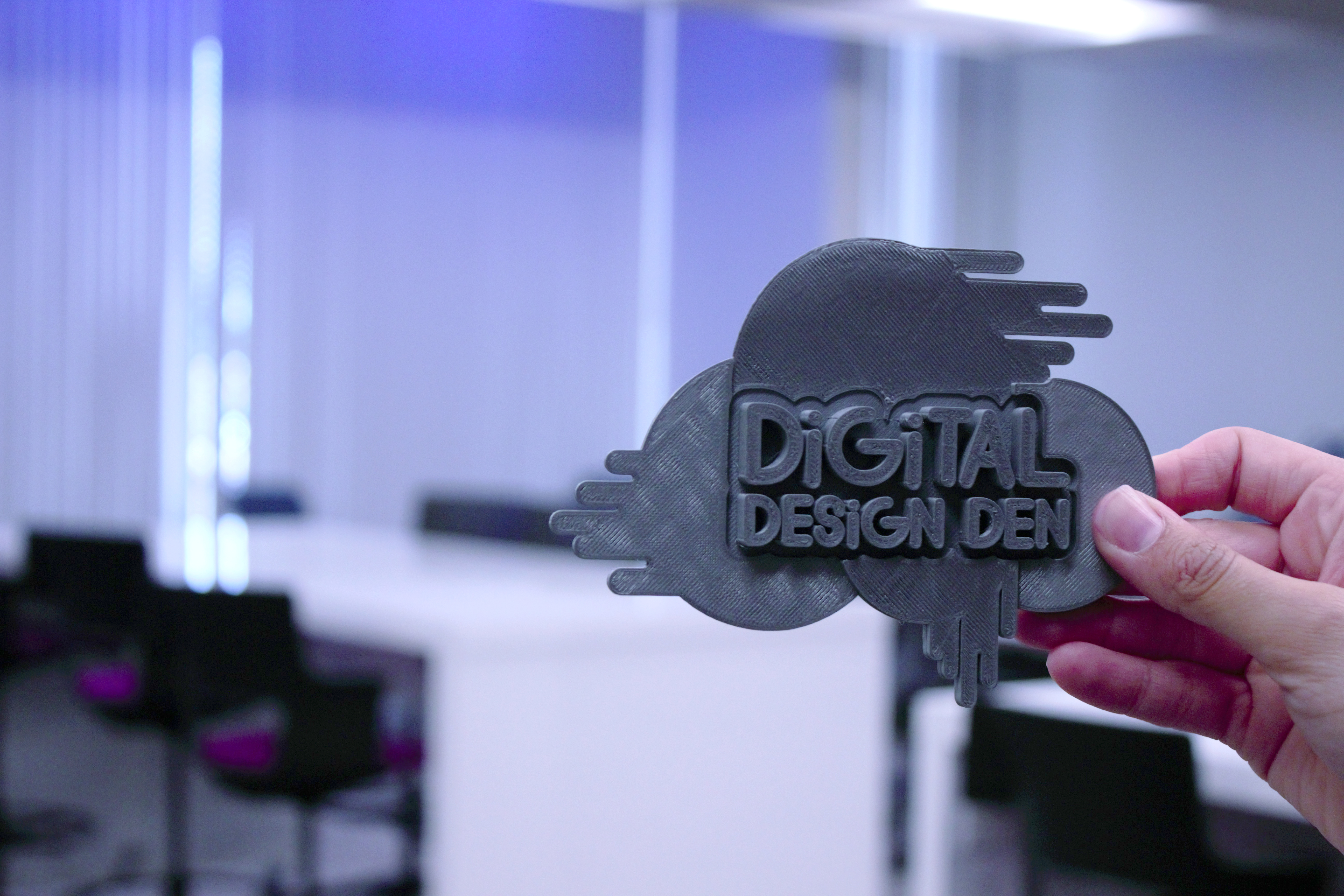 Logo for the Digital Design Den.