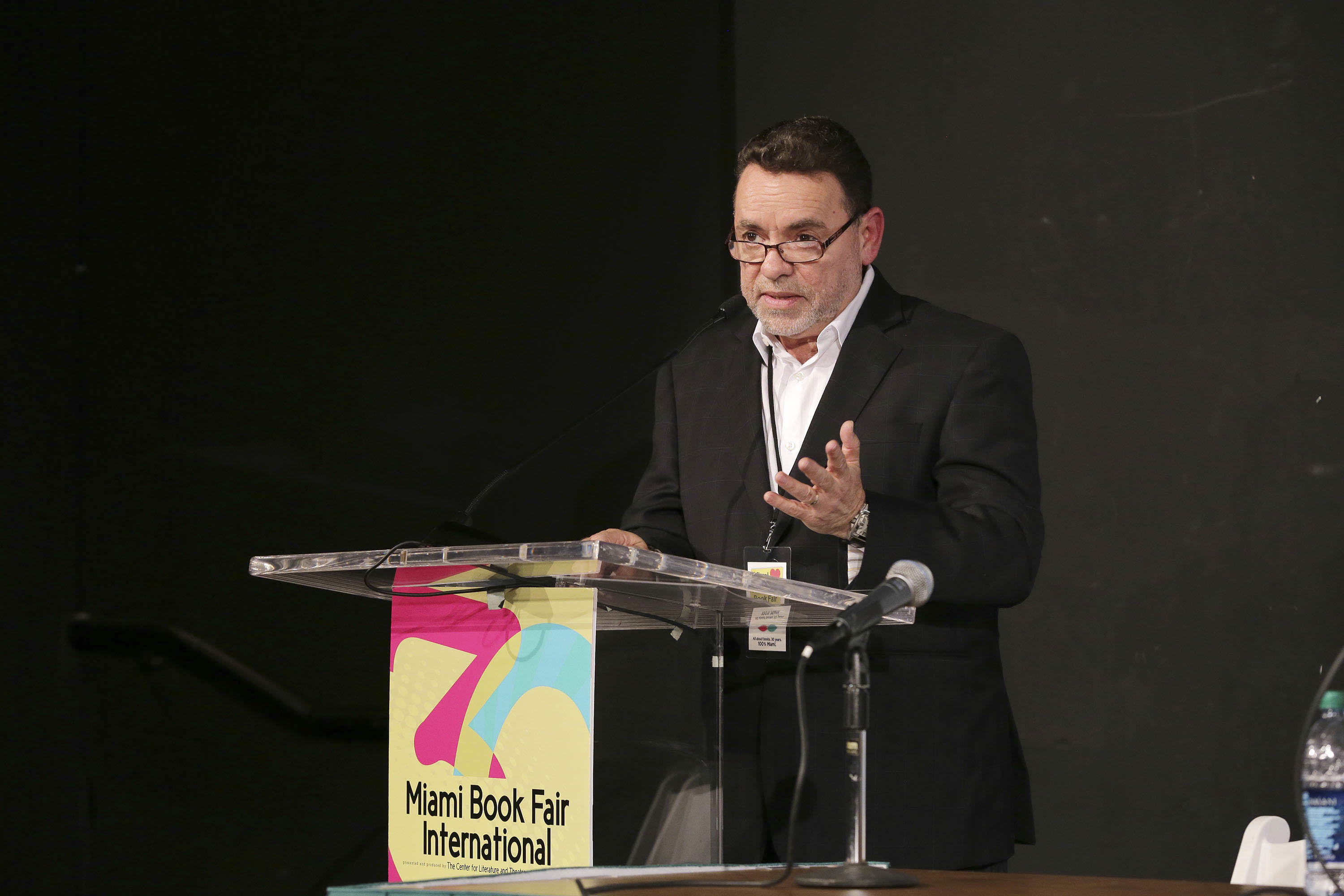 Photo of Alejandro Rios at a podium.