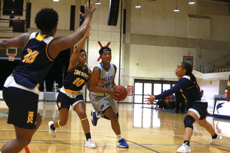 Daliyah Brown trying to make a basket.
