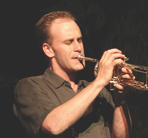 Scott Wendholt paying his trumpet on stage.