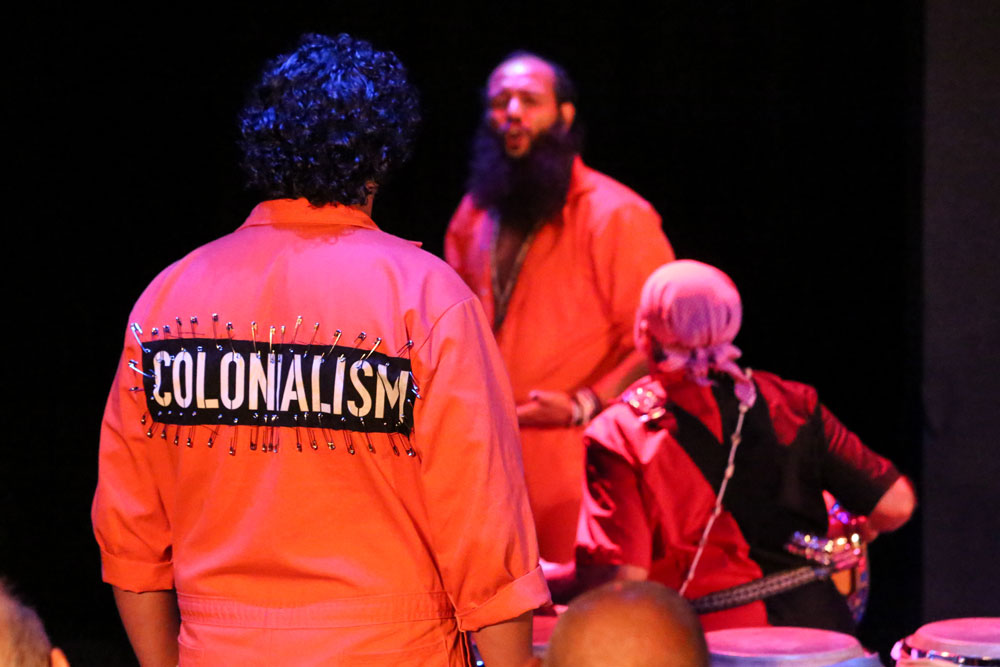 Actors performing on Amal stage.