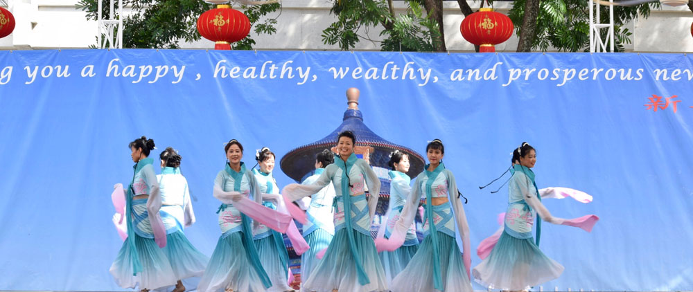 Members of the Chinese Cultural Foundation performing on stage.