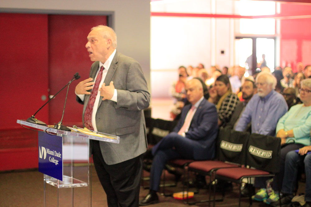 Mark Richard giving a speech to the Board of Trustees.