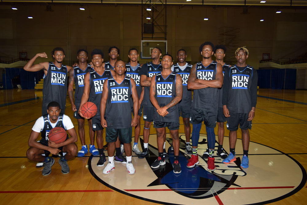 Men's basketball team posing for the camera.