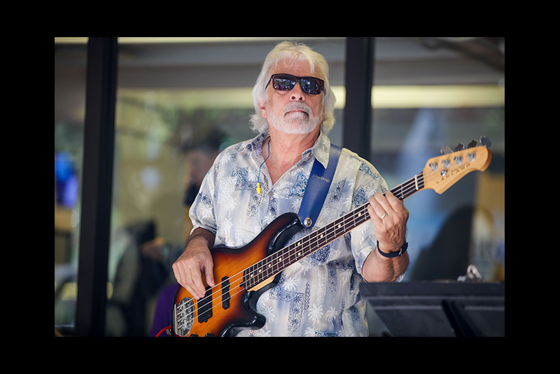 Matthew Bonelli playing bass guitar.