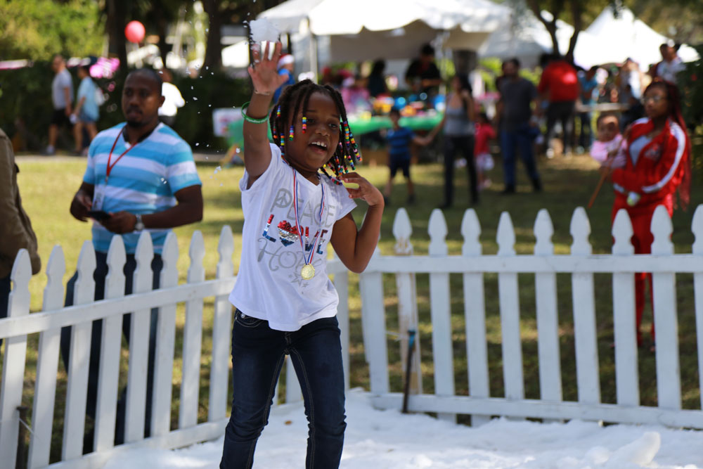 A little girl enjoying the Children's Holiday event.
