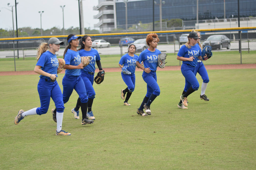 The Lady Sharks softball team at practice.