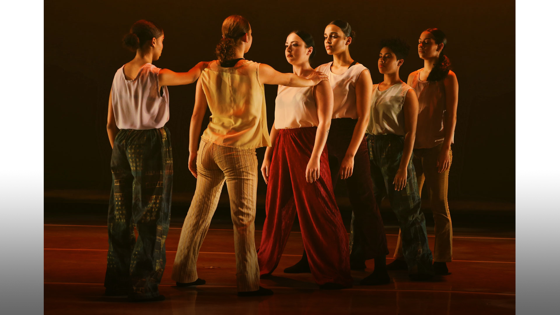 Students performing on stage.