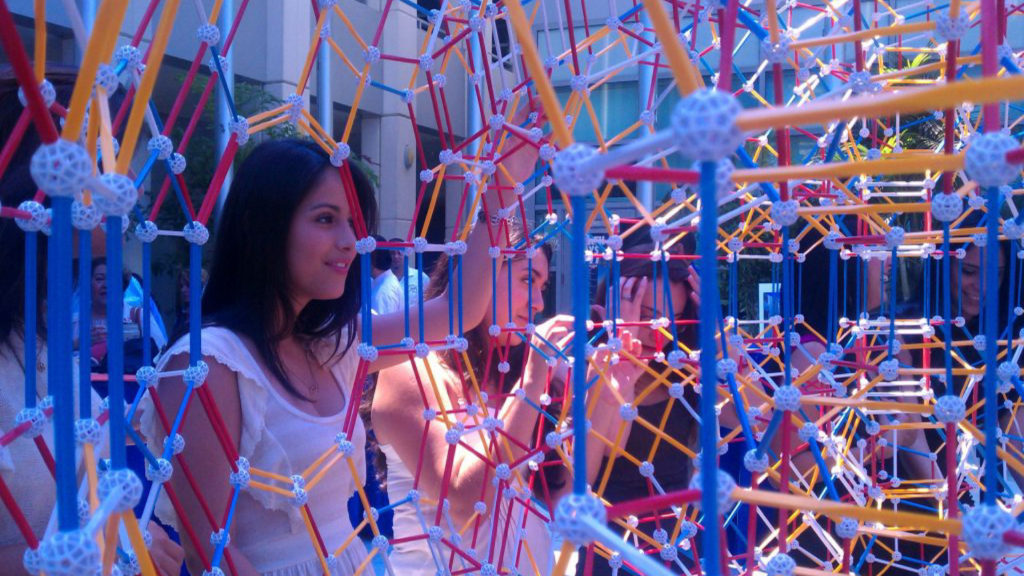 Student admiring the sculpture.