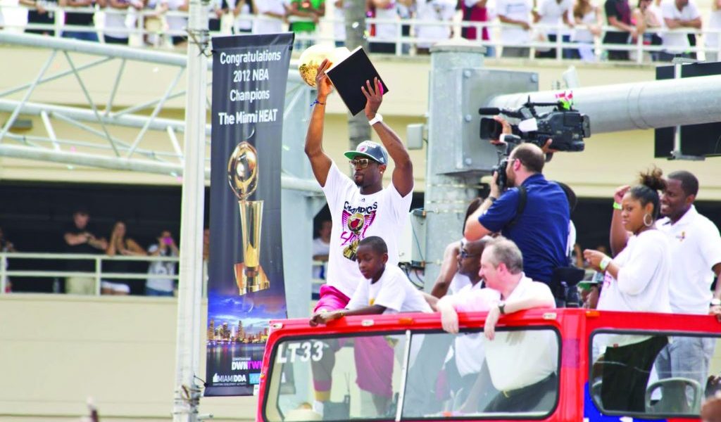 Dwayne Wade holding up the trophy during the parade.