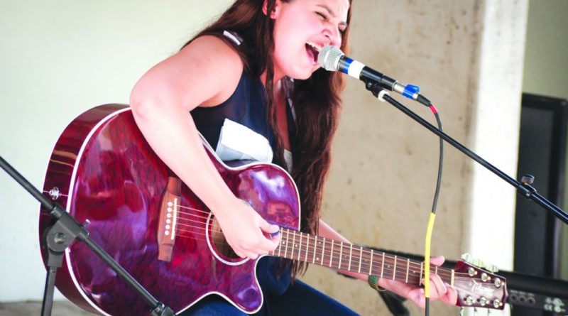 Student performing at Kendall Campus.