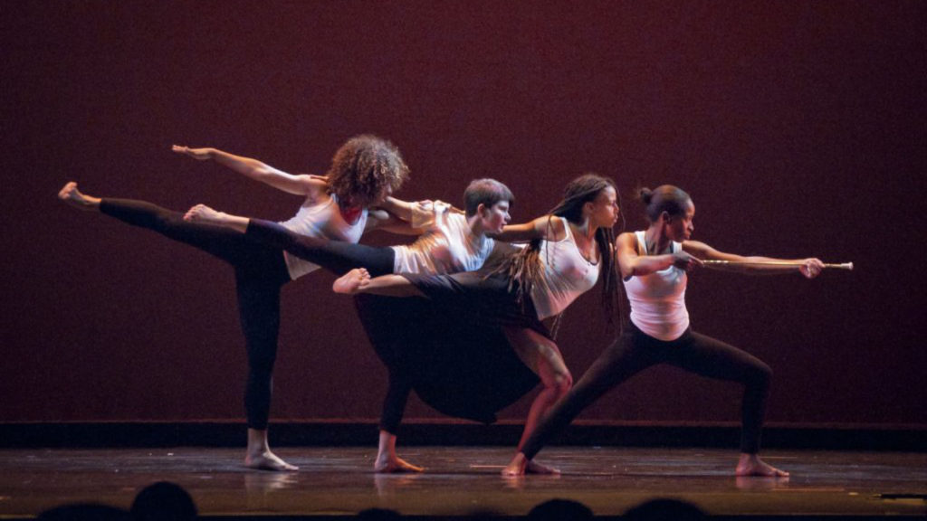 Dancers performing on stage.