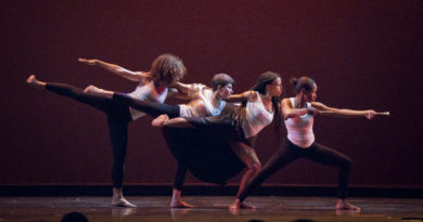 Dancers performing on stage.