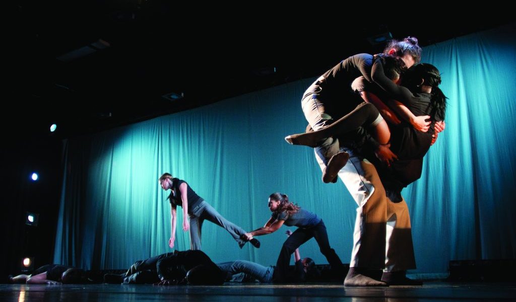 Student dancers performing on stage.