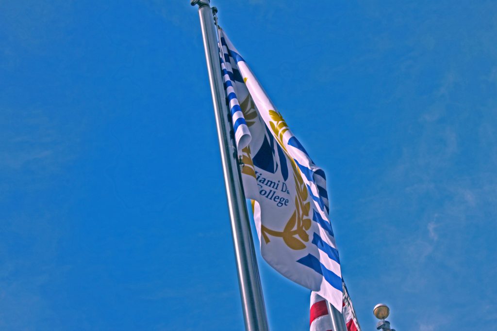 Miami Dade College's new flag flapping in the wind.