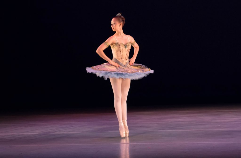 A ballet dancer performing on stage.