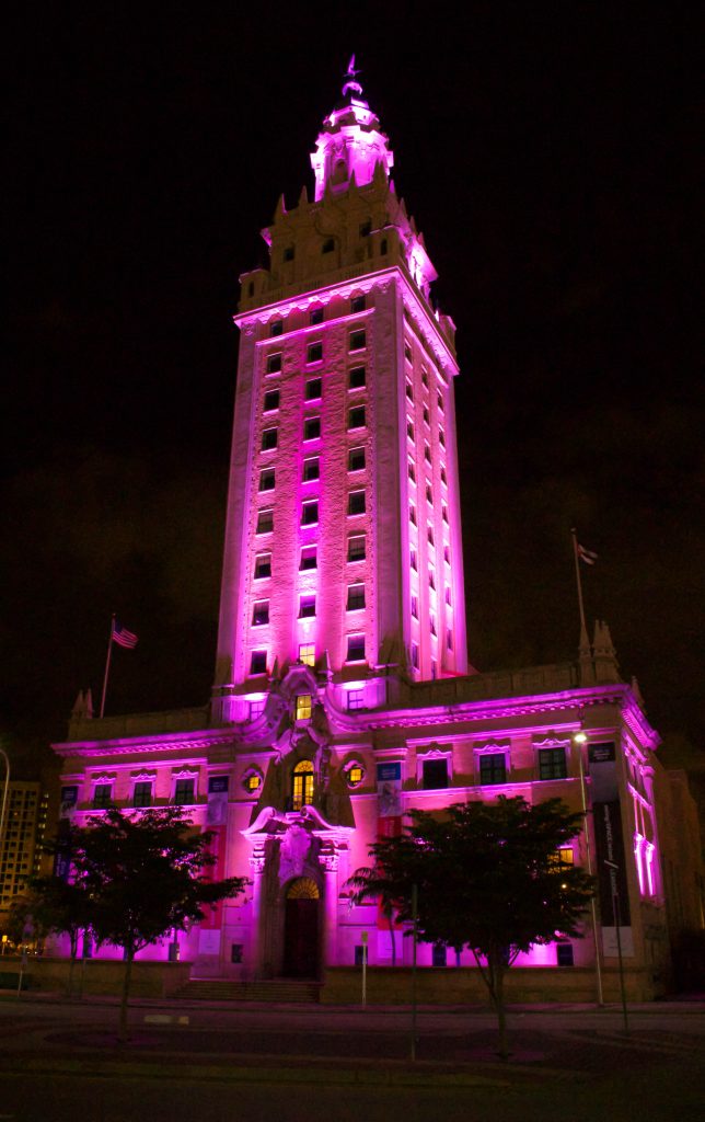 The Freedom Tower in downtown Miami lighted up pink.