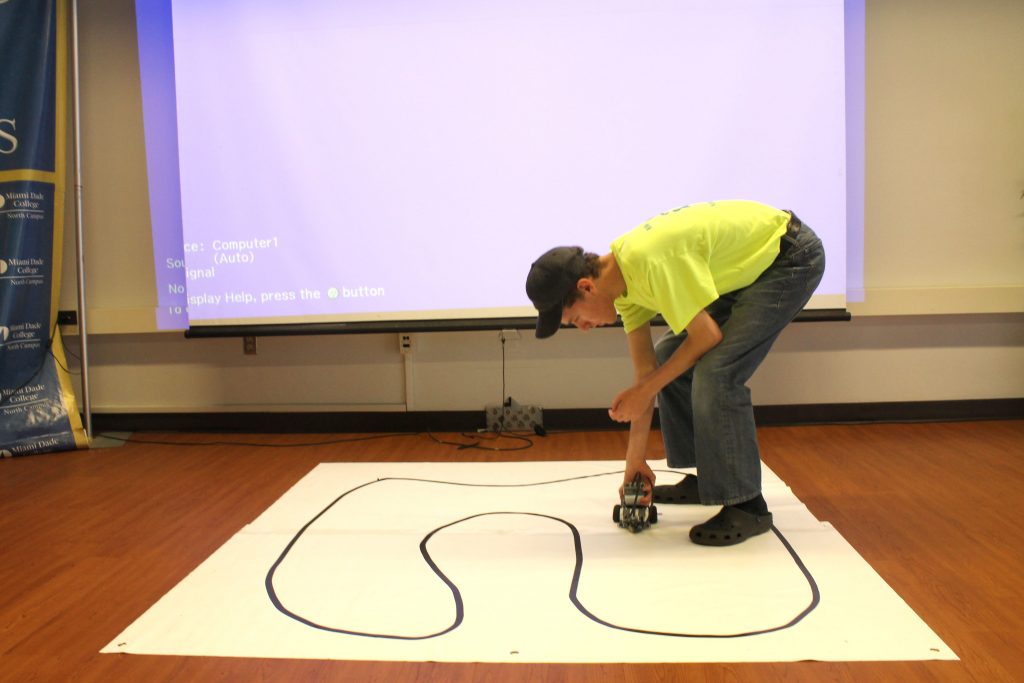 Student testing out a robot.
