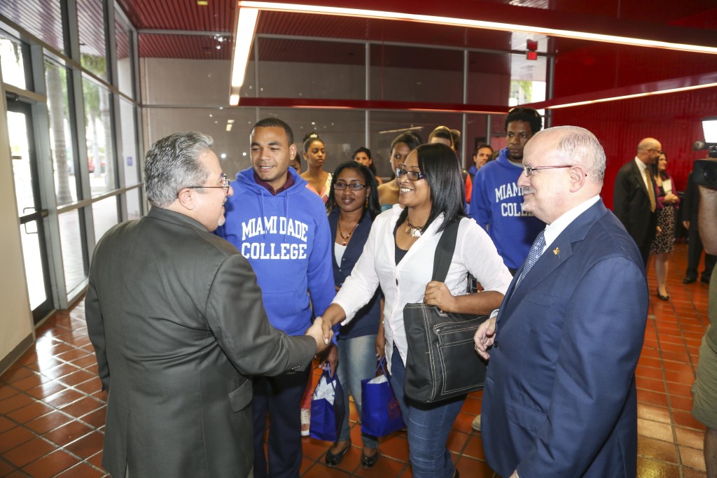 Photo of Cuban students meeting with the college president and others.