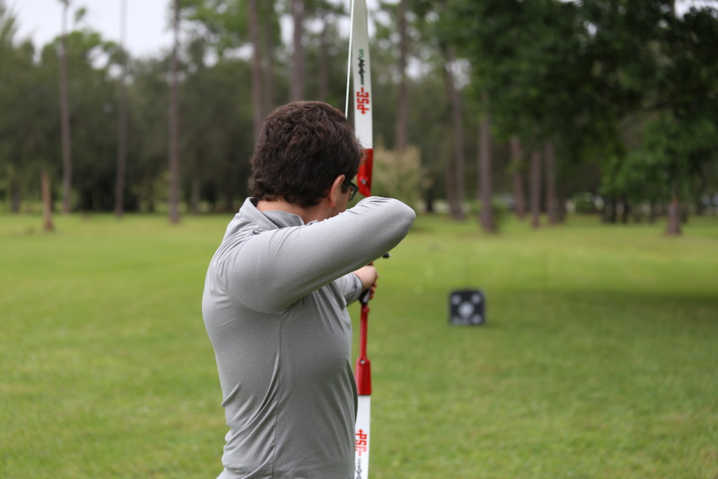 Archery club member Robert Rodriguz about to shoot an arrow.