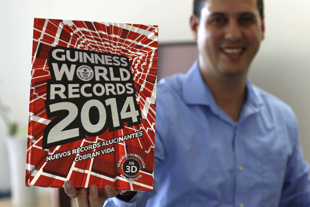 Image of Viera holding the Guinness World Record book.