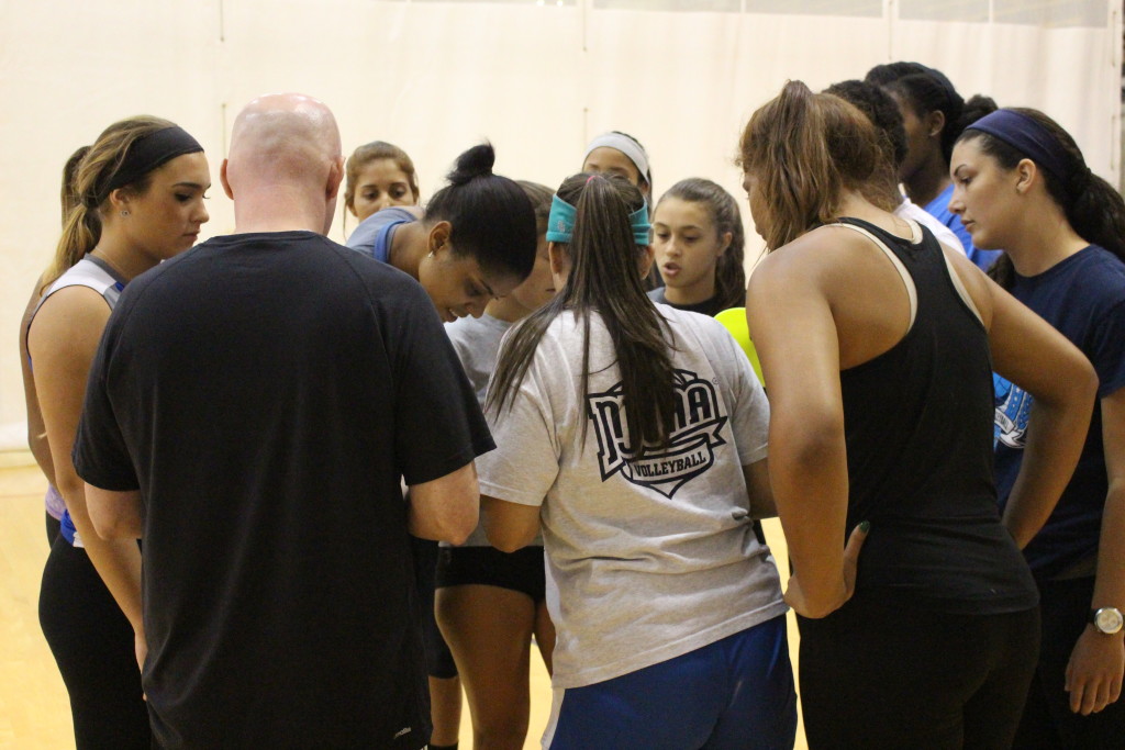 Photo of the Lady Sharks volleyball team during practice.