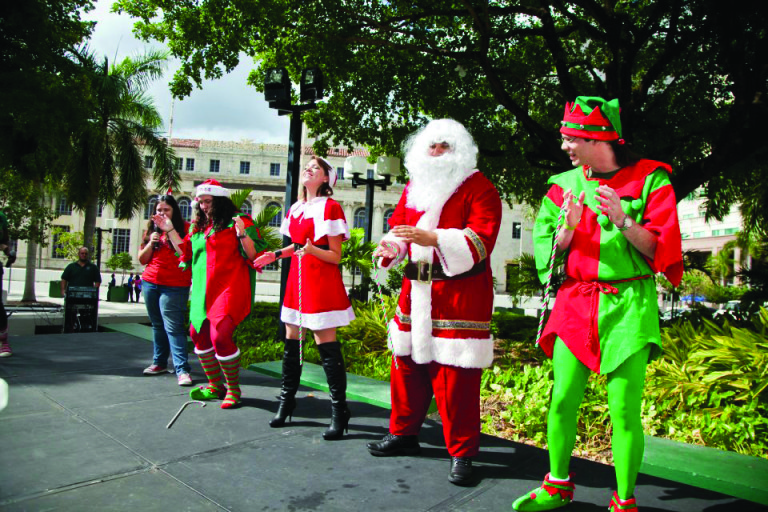 Volunteers dressed as Santa and his elves.